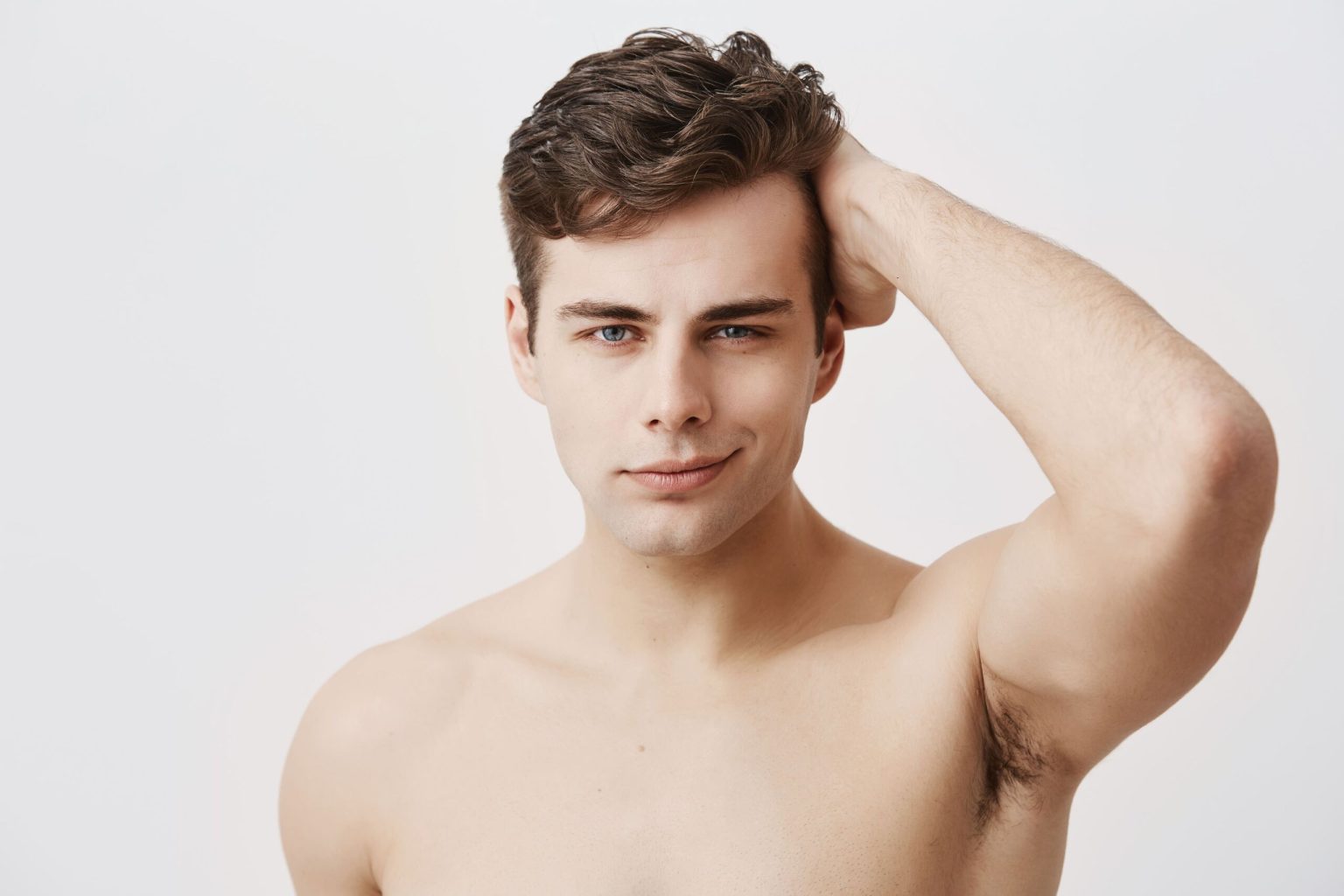 Condifent Young European Man With Stylish Haircut Appealing Eyes Being Naked Touching Dark Hair Posing Handsome Male Model With Healthy Clean Skin Gently Smiling 1 1 1 1536x1024