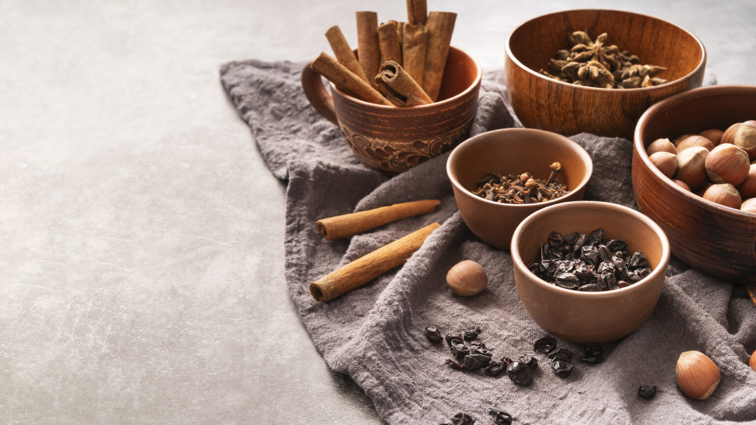 High Angle Decoration With Cinnamon Sticks Hazelnuts Bowls 1536x864