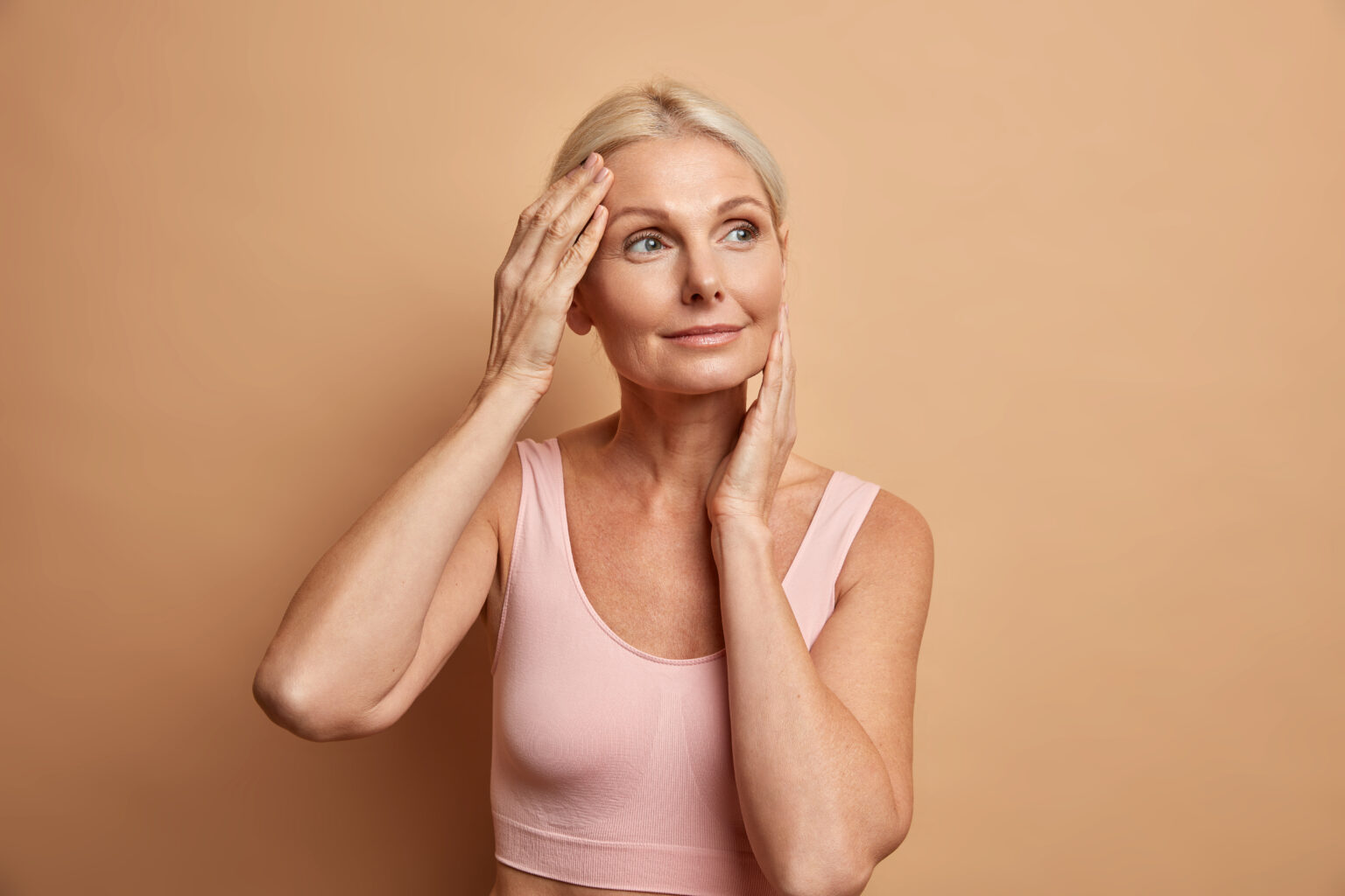 Portrait Mature Elderly European Woman Touches Face Gently Has Perfect Skin Looks Thoughtfully Away Enjoys Her Soft Complexion Cares About Appearance Satisfied After Anti Aging Procedure 1536x1024