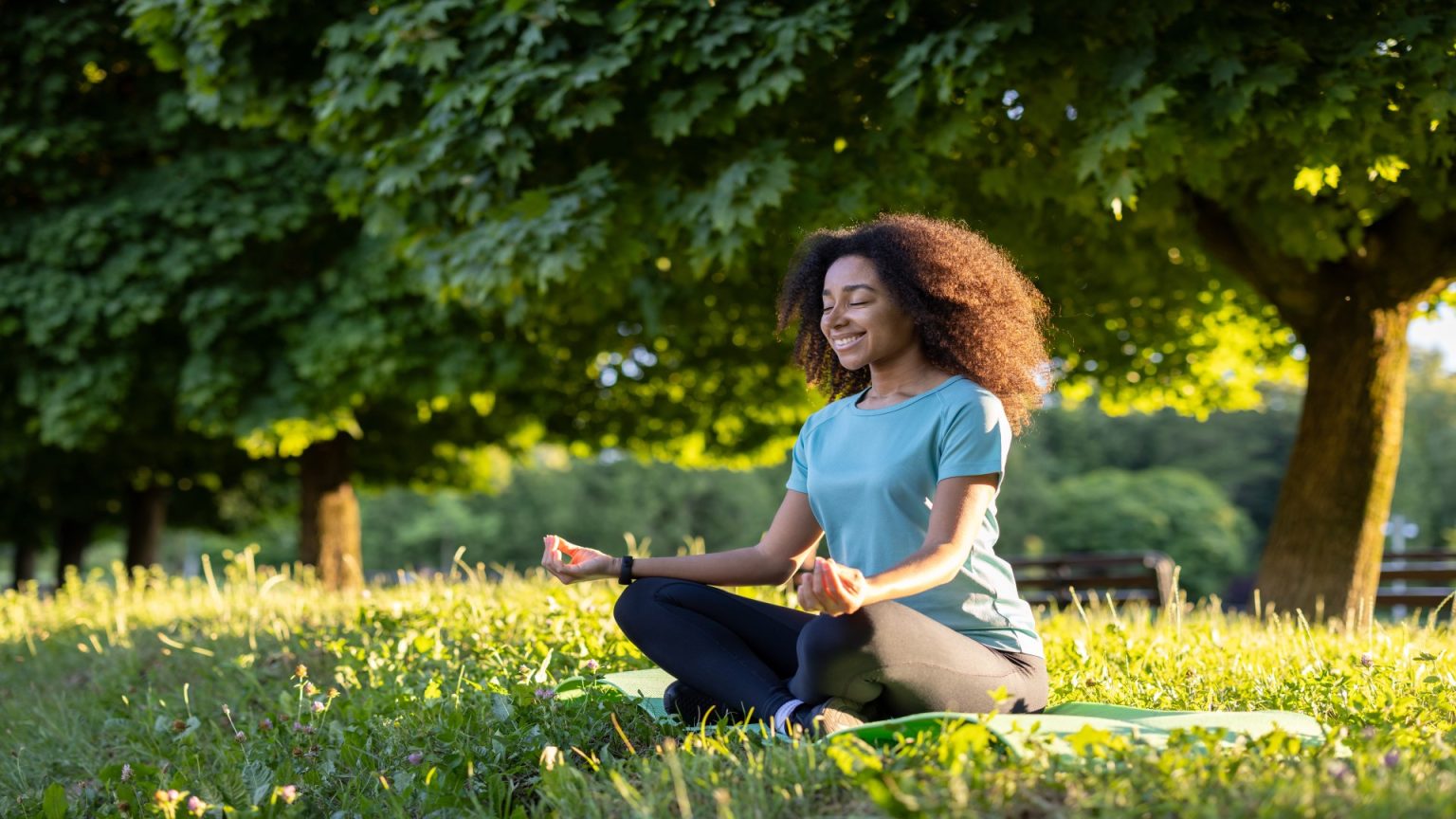 woman meditating in a serene park setting with sun 2025 03 26 03 54 14 utc (1)
