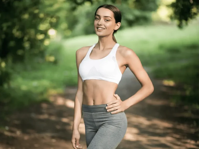 Healthy, confident woman in activewear outdoors